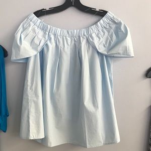 Light blue over the shoulder shirt